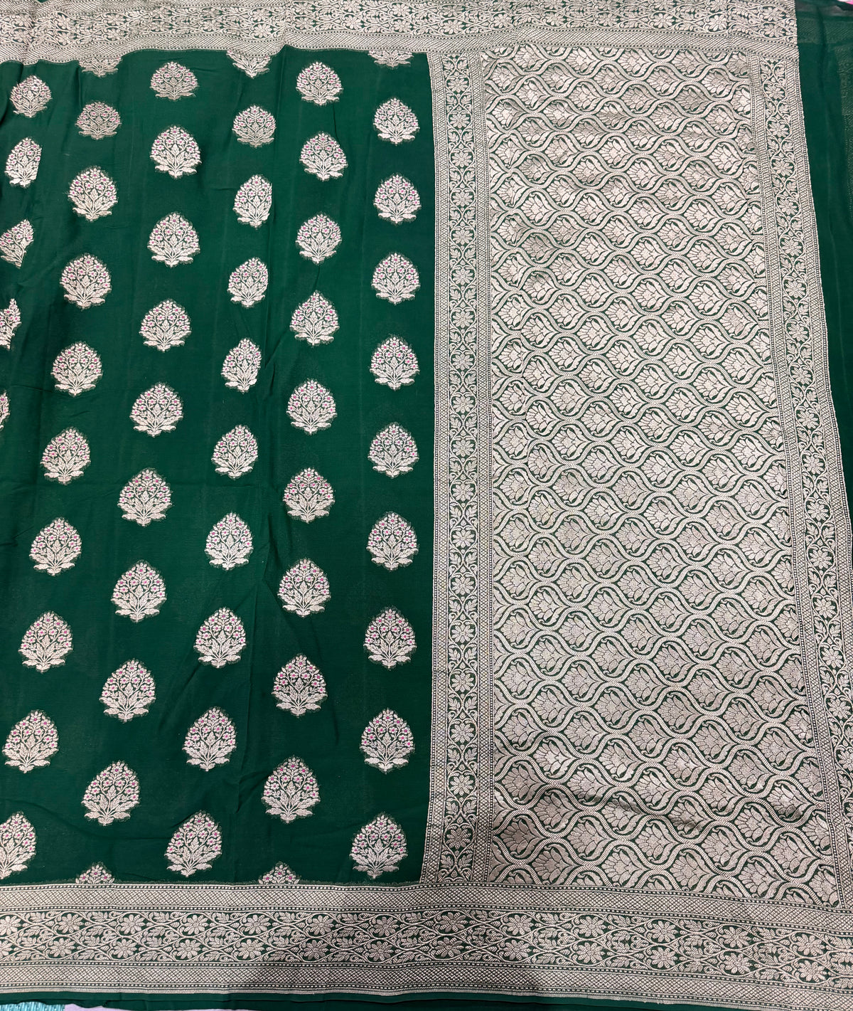Bottle green pure georgette with water zari saree