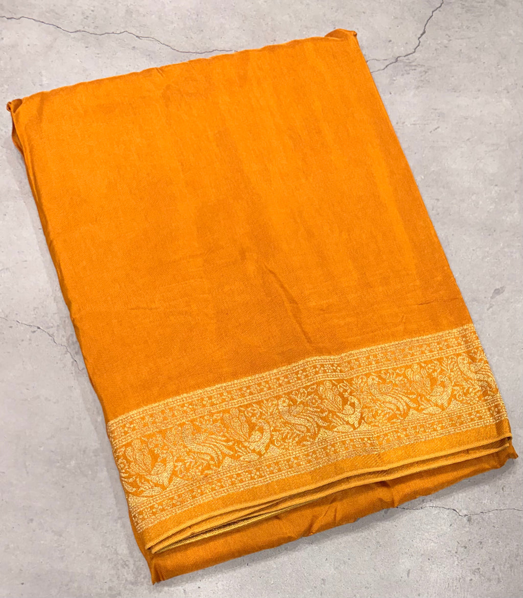 Yellow Kanchi border plain modal silk saree