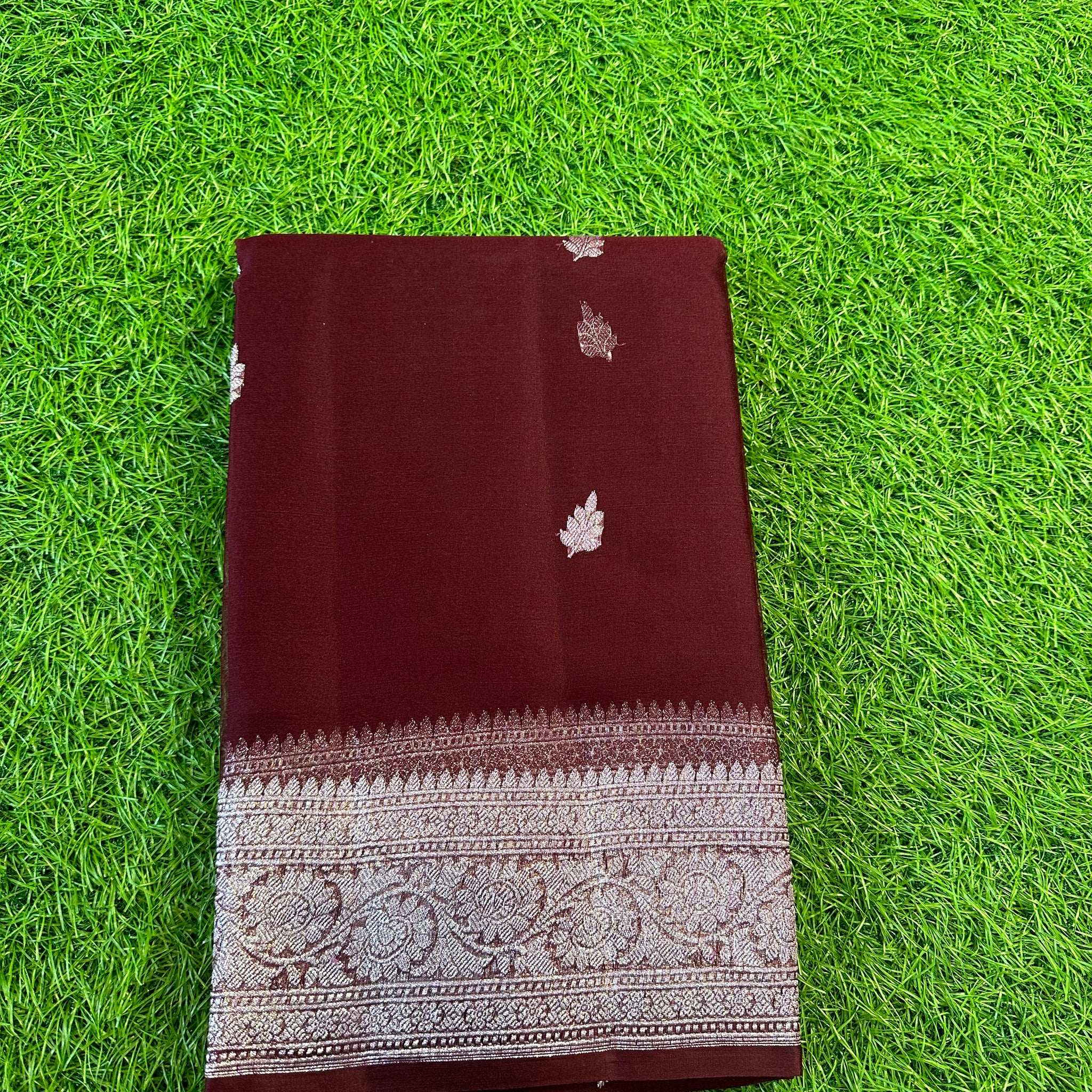 Chocolate brown pure khaddi chiffon Banarasi sarees.