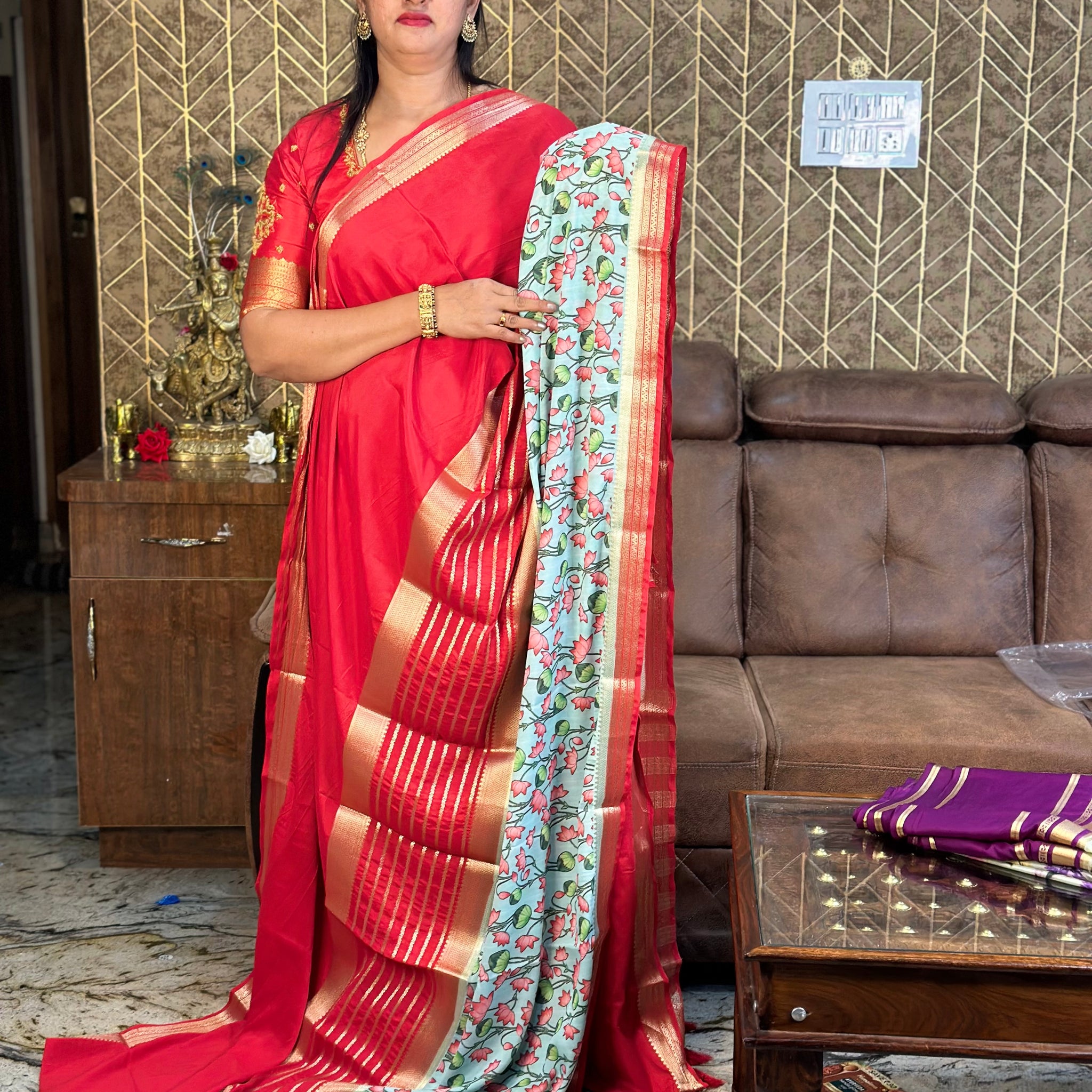 Semi Mysore Silk crepe. Red border with floral prints.