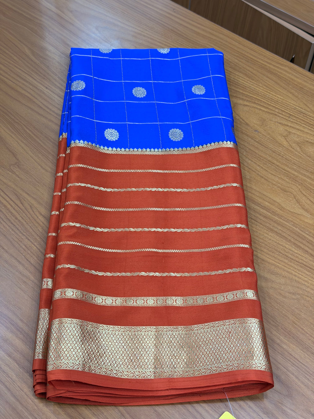 Royal blue and rust orange pure crepe Mysore silk sarees