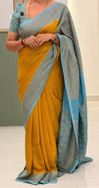 Musturd yellow and sea blue Banarasi crepe chiffon with jaal blouse