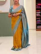 Musturd yellow and sea blue Banarasi crepe chiffon with jaal blouse