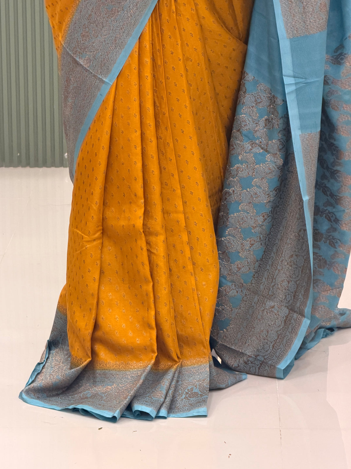 Musturd yellow and sea blue Banarasi crepe chiffon with jaal blouse